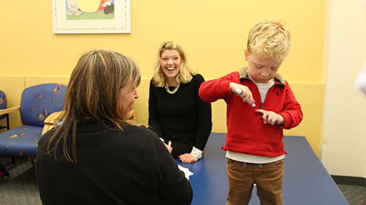 Parent and child in Waisman Center clinics