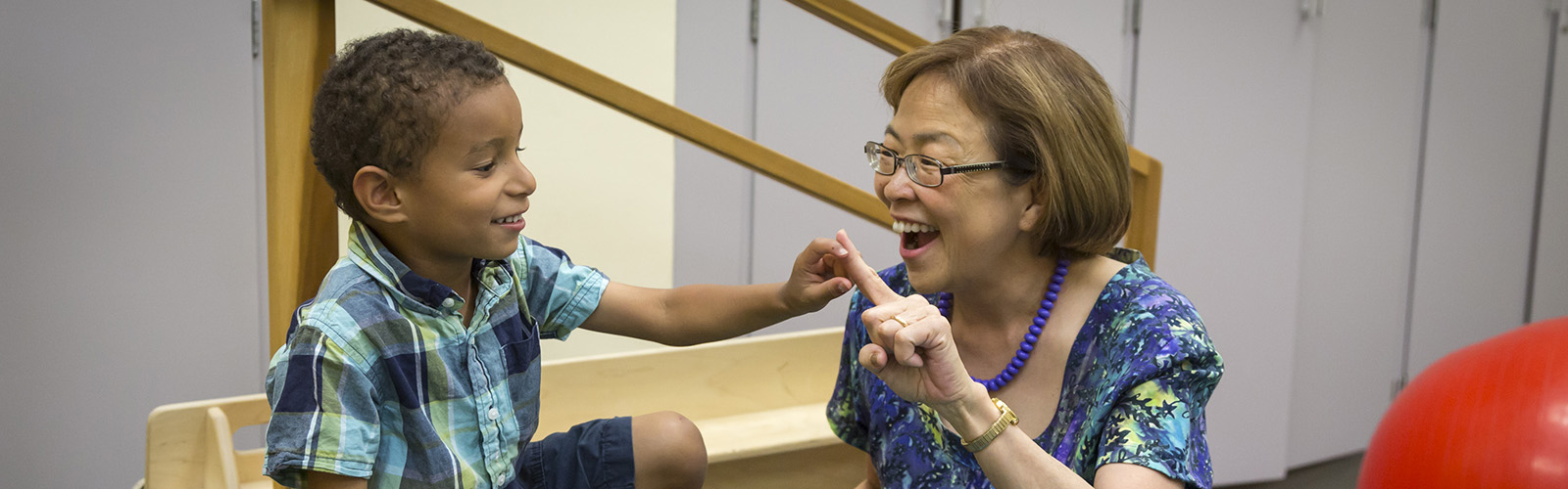 Tina Iyama, MD and patient in clinic room