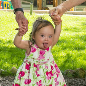 Child walking with grandparents