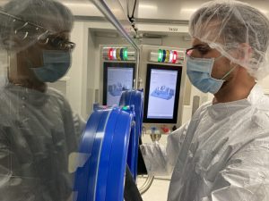 Matt Walch operates the robotic aseptic filling line to package the drug
