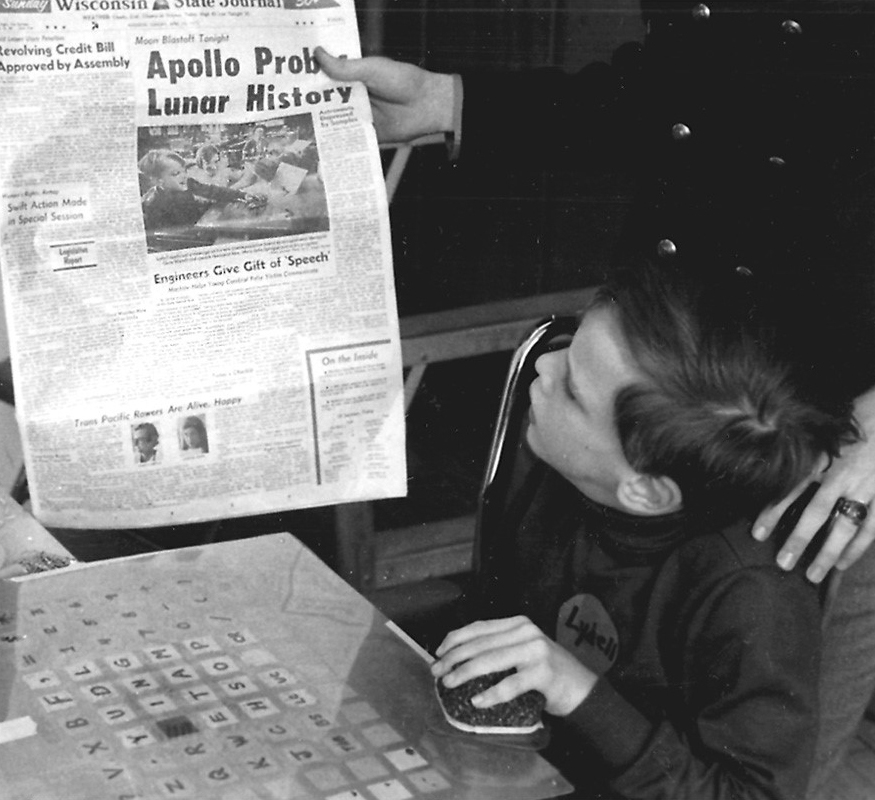 Ludell Swenson reading a news story about his coummunication device