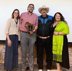 Portillos and SRC staff: (L-R) Aracely and Hector Portillo, and staff from the Souther Regional Center at UCEDD, Tim Markle and Lynn Hrabik.