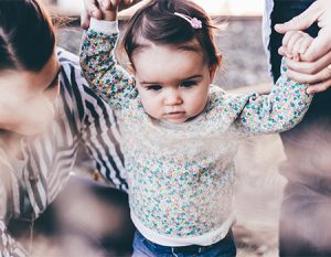 Toddler walking with help