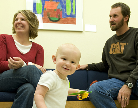 Young child at clinic with parents