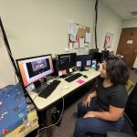 Narindra sets up the research task for Oliver and observes as he watches the videos.