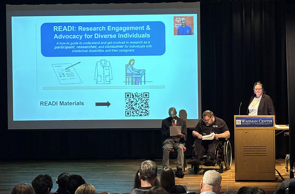 Karla Ausderau and co-researchers Marquis Garner and Edward Kastern present at the Waisman Center