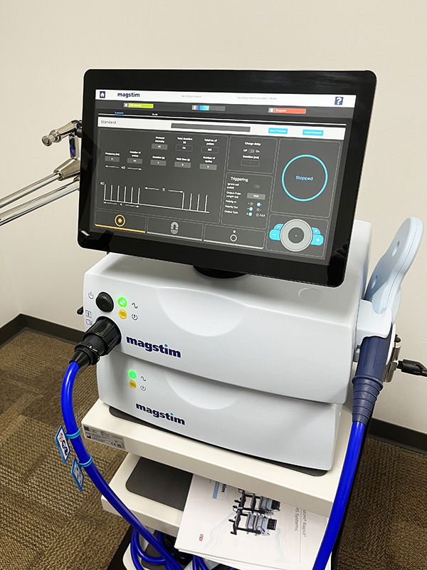 A machine in a cart with a large monitor